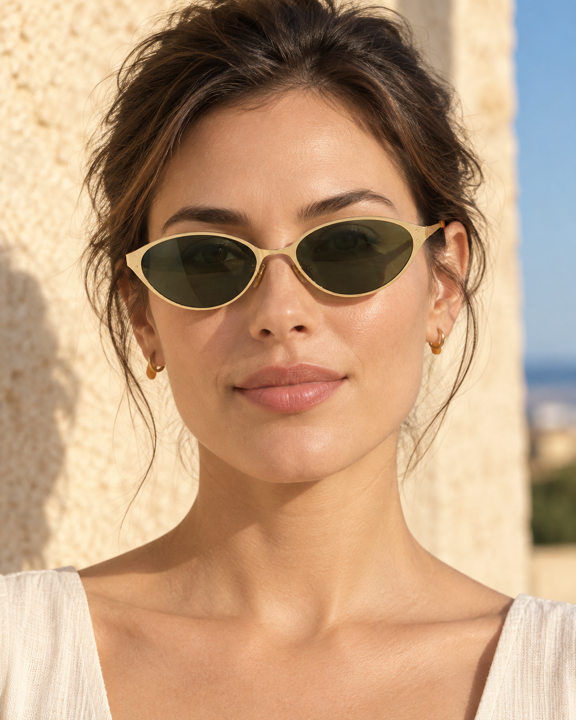 Nerelle Cat-Eye Sunglasses in Gold Green - worn by a woman