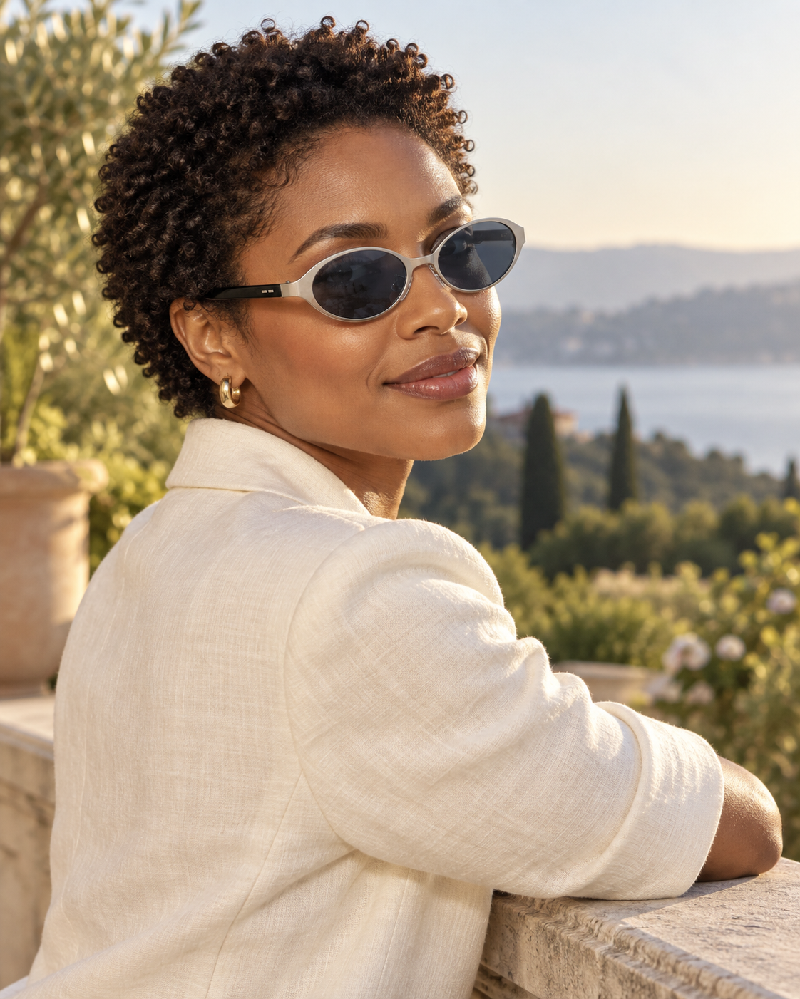Isella Oval Metal Sunglasses in Silver Smoke - worn by a woman