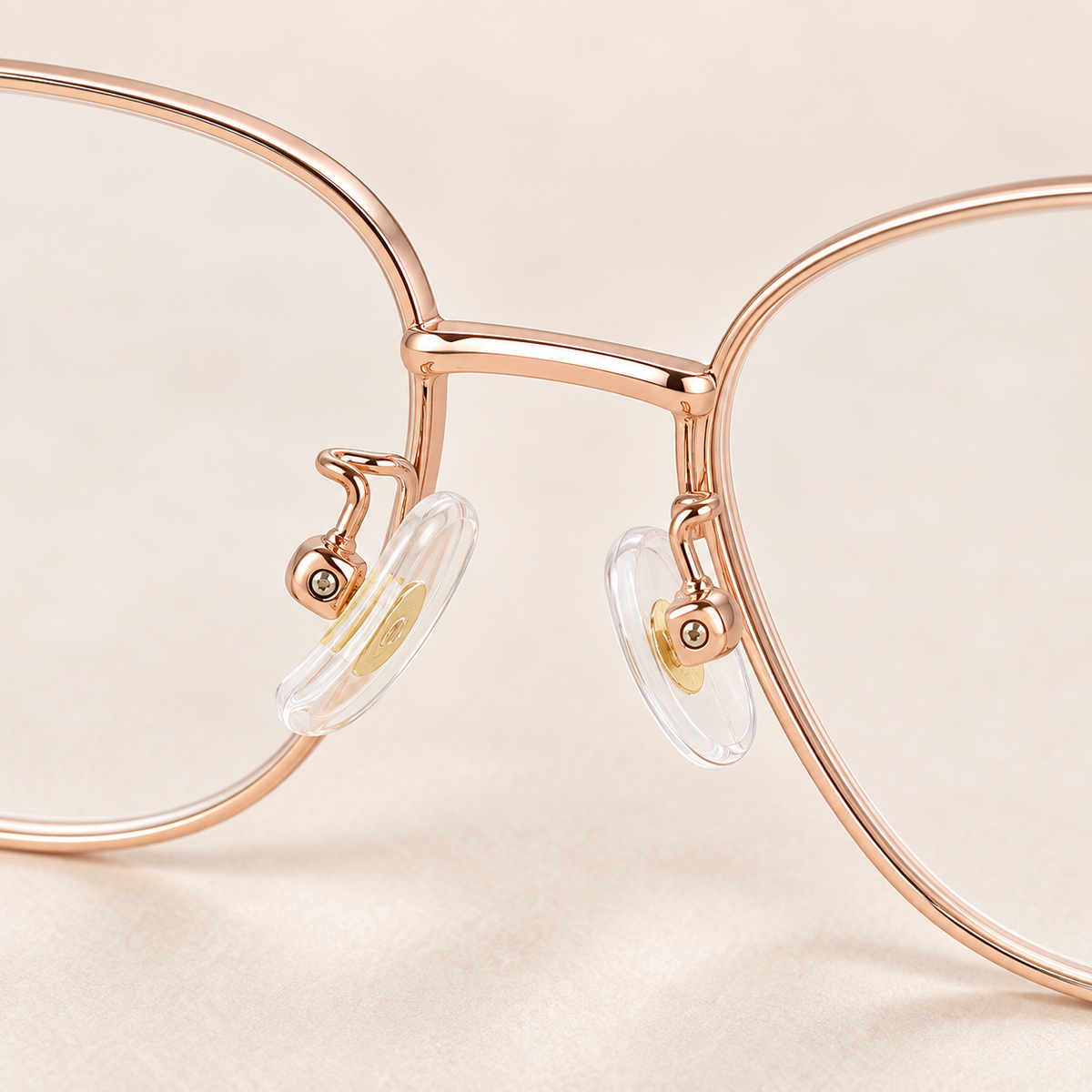 Odeline Titanium Cat-Eye Frames in Rose Gold - fine bridge and adjustable nose pads detail