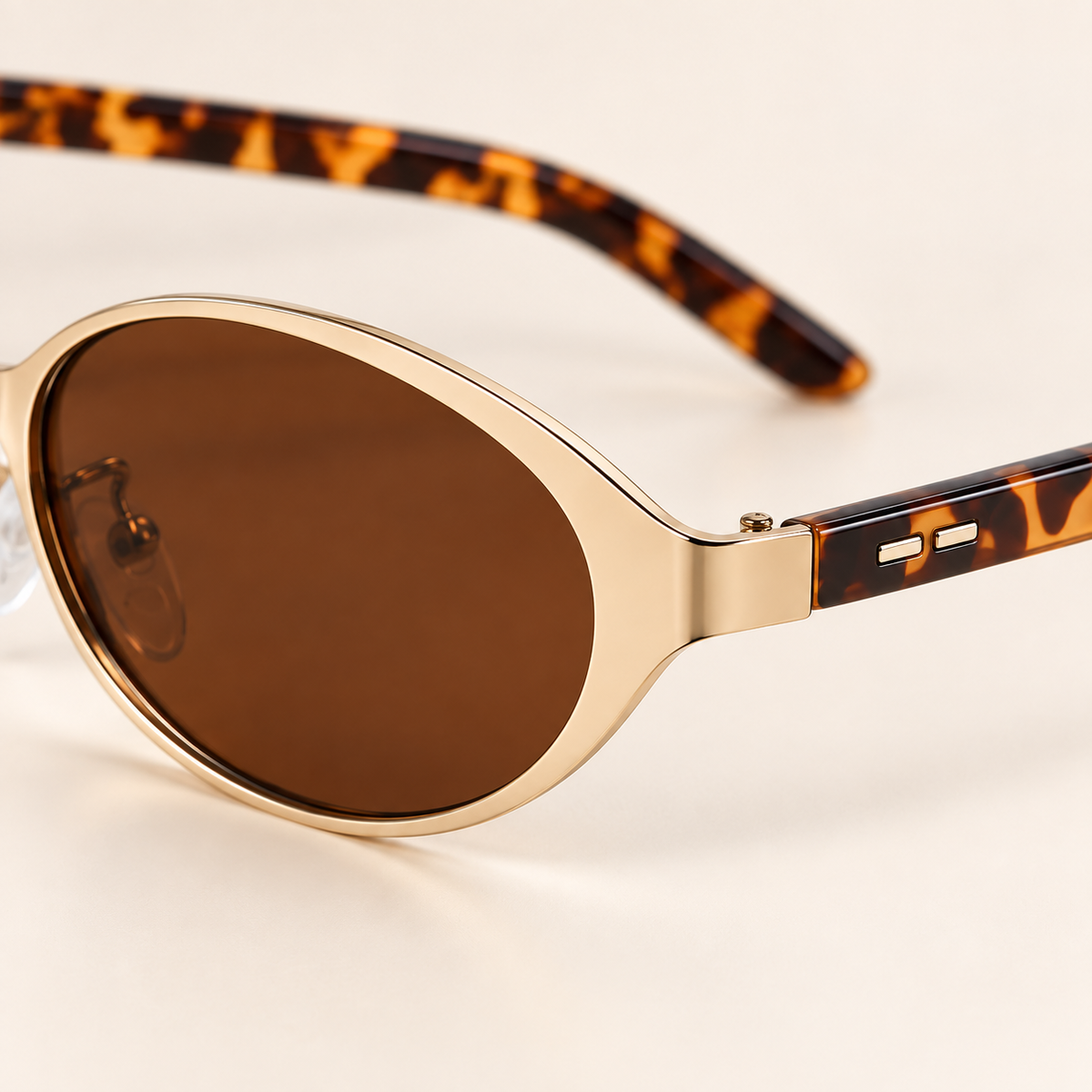 Isella Oval Metal Sunglasses in Gold Tortoise - polished corner and tortoiseshell temple detail