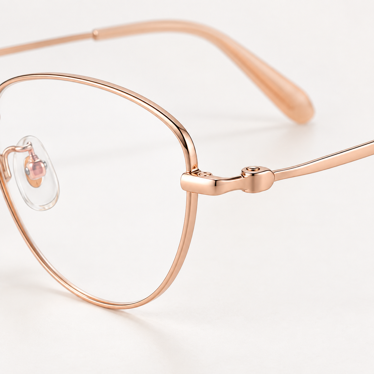 Odeline Titanium Cat-Eye Frames in Rose Gold - sculpted temple connection detail