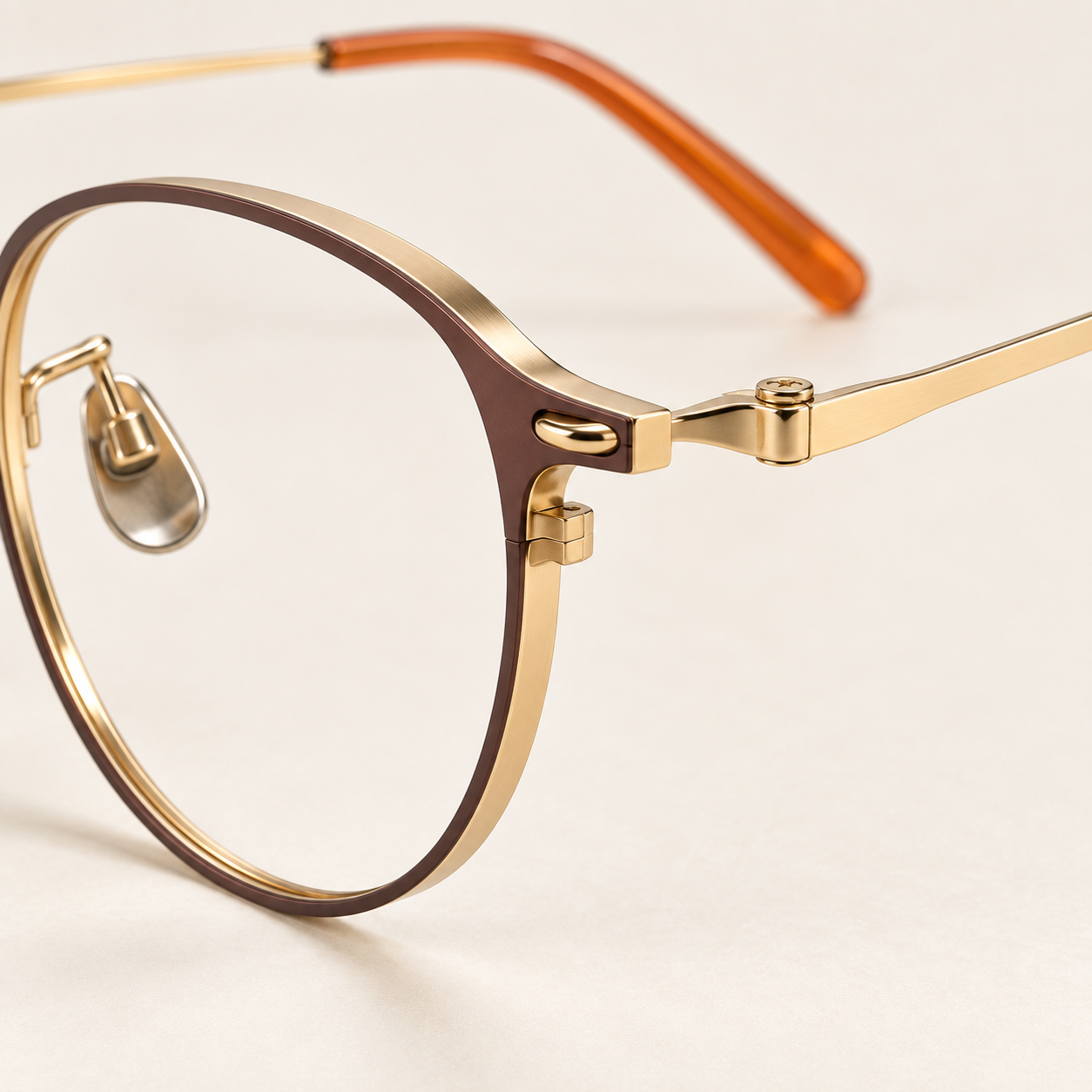 Aveline Titanium Frames in Brown Gold - sculpted hinge and rim profile detail