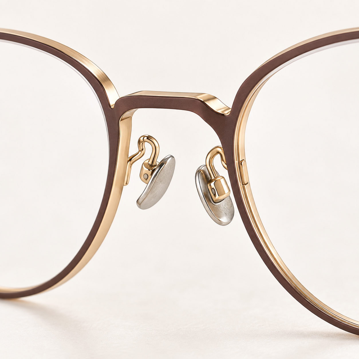 Aveline Titanium Frames in Brown Gold - bridge and adjustable nose pads detail